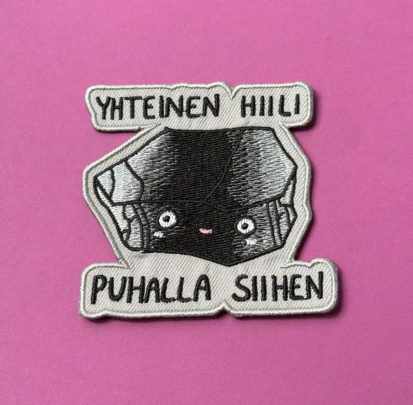Yhteinen hiili, puhalla siihen - Kangasmerkki