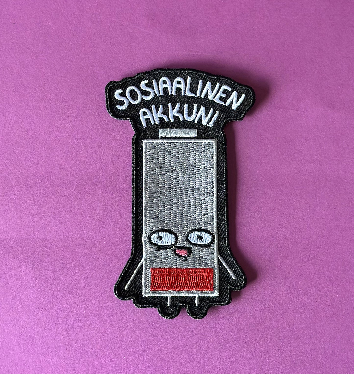 Sosiaalinen akkuni - Kangasmerkki