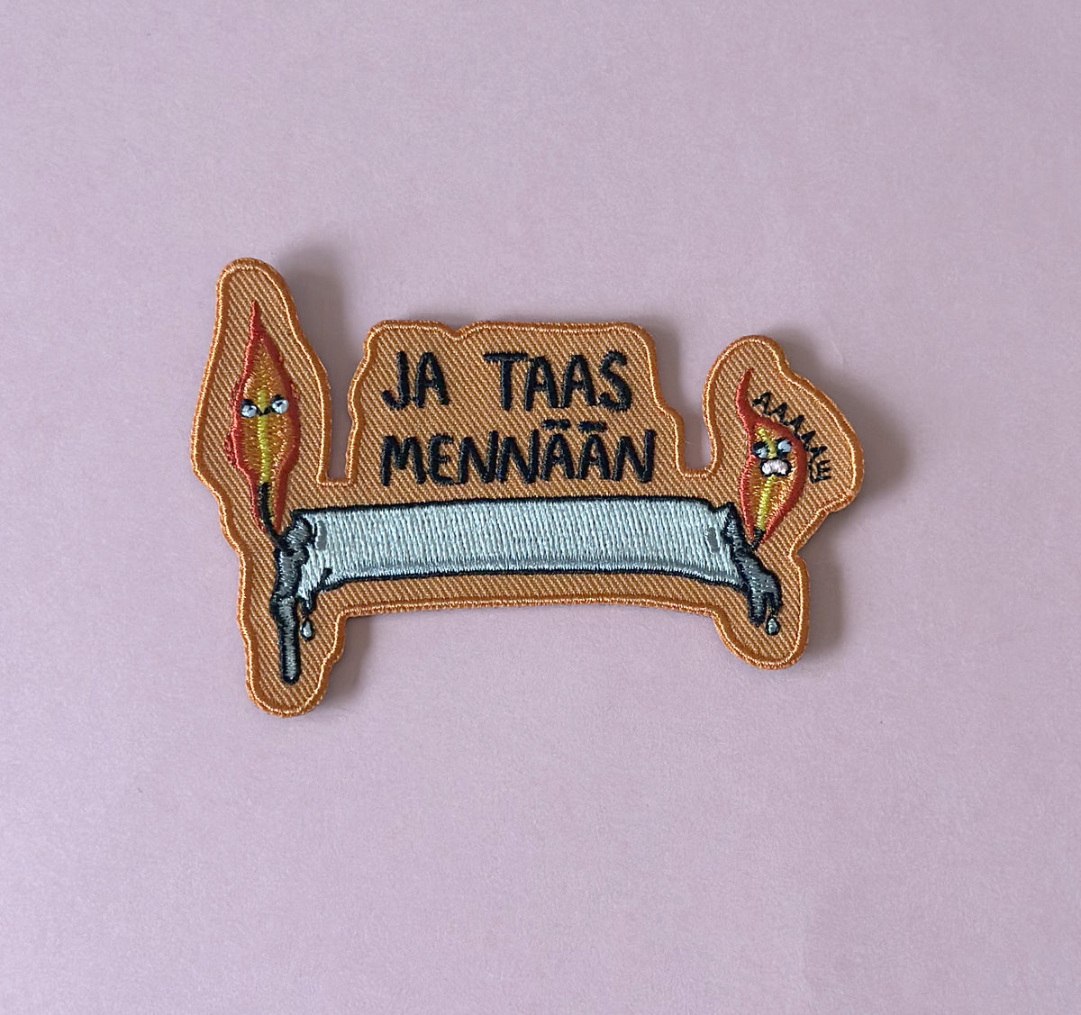 Ja taas mennään - Kangasmerkki